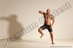 Underwear Gymnastic poses Man Black Muscular Bald Dancing Dynamic poses Academic